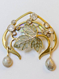 An Art Nouveau gold, diamond, opal, pearl, plique-à-jour enamel brooch by Georges Fouquet, circa 1900.: