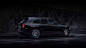 Side exterior view of the Rolls-Royce Black Badge Cullinan motor car stationary with driver door open