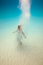 I am standing on bottom of the ocean... I can almost hear it breathe... — in The Bahamas. (Elena Kalis Underwater Photography)