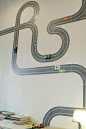 if I had a boy would totally do this in his room. Its stick decals so you can move the cars: 