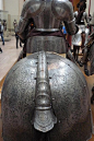 Plate armour of horse and the knight in its saddle, from behind. Shows the crupper and saddle cantle of the horse's armor. Italy,  1570