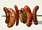 Various grilled sausages on a skewer_创意图片