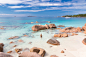 Woman enjoying Anse Lazio picture perfect beach on Praslin Island, Seychelles.