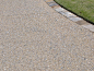 exposed aggregate concrete patio with pavers. Want this as a small patio on front of our house.