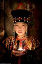  Pictured is a young girl Buryat girl from Buryatia Republic, Siberia. Almost all Buryat women own a traditional costume, which they wear on holidays. Subtle differences in these outfits denote where precisely a woman is from and if she is married or not