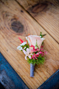 pink boutonniere http://www.weddingchicks.com/2013/09/05/geometric-wedding/