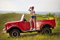 People 1800x1200 women model blonde long hair red lipstick fingerless gloves Tied top belly jean shorts sneakers profile smiling depth of field sky women with cars red cars outdoors women outdoors Aleksey Lozgachev