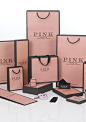 Thomas Pink Luxury Packaging Range . An ever increasing range of packaging including carrier bags, pochettes, rigid boxes, suitcovers, tissue, ribbon, stickers, draw string boxes and other seasonal additions all printed in Thomas Pink 'pink'!