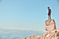 man standing on rock