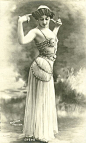 Vintage belly dance photo. The chains laying across her hips are very interesting to me. Not your typical hip scarf! The bra is also sort of weird, but I like it!