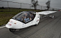 The ICARE Project: A Trip Around the World in a Solar and Wind-Powered Car