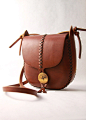 leather bag. under the tree. tall tree in by underthetreeithaca
