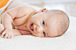 Mixed race baby laying on blanket by Gable Denims on 500px