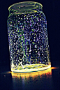 Faries in a jar. I will be trying this with wine bottles. Glow sticks cut open and dumped into a jar with glitter. What an inexpensive idea for summer lights on the patio.