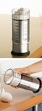 Adjustable measuring cup - slide the cup up or down to adjust. Works with solids and liquids.: