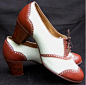 Spectator pumps are high heeled shoes that have two contrasting colors normally at the toe and heel. These types of shoes were popular in the 1920s and 30s.