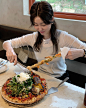 Photo by Toute, 뚜뜨 on April 03, 2024. May be an image of 1 person, pizza, skewer and mozzarella.