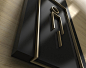   Detail view of an amenity sign   in painted acrylic and brushed brass.  