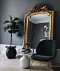 Large Baroque Mirror with a green velvet Beetle Chair by Gubi