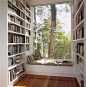 Window seat with books.