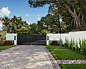 Inspiration for a large modern full sun front yard concrete paver driveway in Austin for spring.