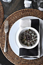 round wicker placemats, wicker napkins, succelents, black linen napkins, place settings, table settings | Burgess In House