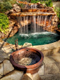 Backyard oasis with hot tub and waterfall pool