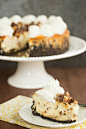 Cheesecake with Oreo crust and chopped Snickers bars by Brown Eyed Baker on Flickr.