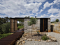 Archier Recycles 270 castaway concrete blocks to create modern cliffside home