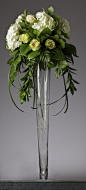 White and green tall wedding centerpiece