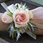 One of my favorites: wrist corsage with Star Blush spray roses, green leucadendron and ivory chiffon ribbon on an ivory pearl bracelet