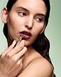 Photo by Prada Beauty on January 11, 2024. May be an image of one or more people, makeup and lipstick.