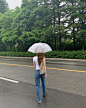 Photo shared by @rovorin on May 04, 2024 tagging @khaite_ny. May be an image of 1 person, parasol, umbrella and road.