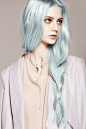 long icy, pastel blue hair in a very loose braid.
