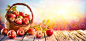 Red Apples In Basket On Wooden Table At Sunset stock photo