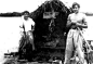 Alberto Granado and Ernesto "Che" Guevara (right) with Alberto Granado (left) aboard their "Mambo-Tango" wooden raft on the Amazon River in June 1952. The raft was a gift from the lepers whom they had treated.