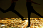 人,城市,都市风景,户外,腰部以下_82981661_Women Leaping in Air Over City at Night_创意图片_Getty Images China