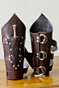 Elaborate+bracers+held+closed+with+three+leather+belt+strips,+includes+small+dagger+in+a+riveted+pocket.+Available+in+any+color.+