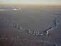 Photo: Large ice floes on the Southern Ocean. Ridges are caused by floes bumping up against one another, forming walls of ice.