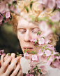 Person Standing in Front of Pink Petaled Flowers