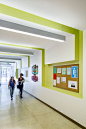 Modern mid-century Los Angeles school reuse bright hallway.