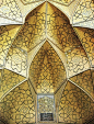 Detail from the Seljuk Friday mosque at Isfahan. The architectural complexity of the muqarnas is highlighted by the geometric pattern of the decoration.