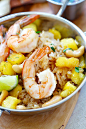 Pineapple fried rice ready to serve from skillet with shrimp, cashews, and pineapple