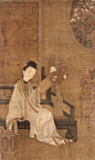 China, hanging scroll of a reading court-lady, Qing dynasty, presumably 18th century. Background with magnolia and a landscape painting. Ink and colour on silk. Calligraphy and three seals.