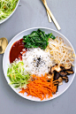 Vegan Korean Bibimbap - a classic Korean dish of rice and seasonal sauteed vegetables, served with a spicy Gochujang chilli sauce. #vegan #korean #bibimbap #veggies #healthy #lowfat #colorful #801010