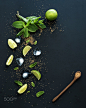 Ingredients for mojito. Fresh mint, limes, ice, sugar over black backdrop. Top view. by Anna Ivanova on 500px