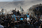 Description of  Afghan presidential candidate Abdulla Abdulla (C) waves to a crowd of supporters as he arrives for political rally in Dashtak, Afghanistan on March 31, 2014.  Afghanistan will vote on Saturday to choose a successor to President Hamid Karza