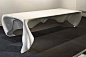 [桌布桌子创意设计] 这个来自德国一家创意工作室的桌子是对现代家具的重新定义。它突破了传统家具固化、呆板的形象，让桌布成为桌子的一部分，将家具的实用性与艺术的流动性完美结合，从而带给了我们愉悦的视觉体验。