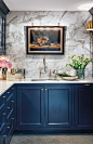 Opulent tones, marble materials and midnight blues - Heritage Bathrooms loves this gorgeous kitchen: