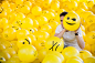Ball.Room. / 2016 : I have created 65 different well-known as well as new emojis that have been put on 2015 yellow inflatable beach balls using 14 character sets of different typefaces. Then I filled up a room with these yellow balls.Every visitor can tak